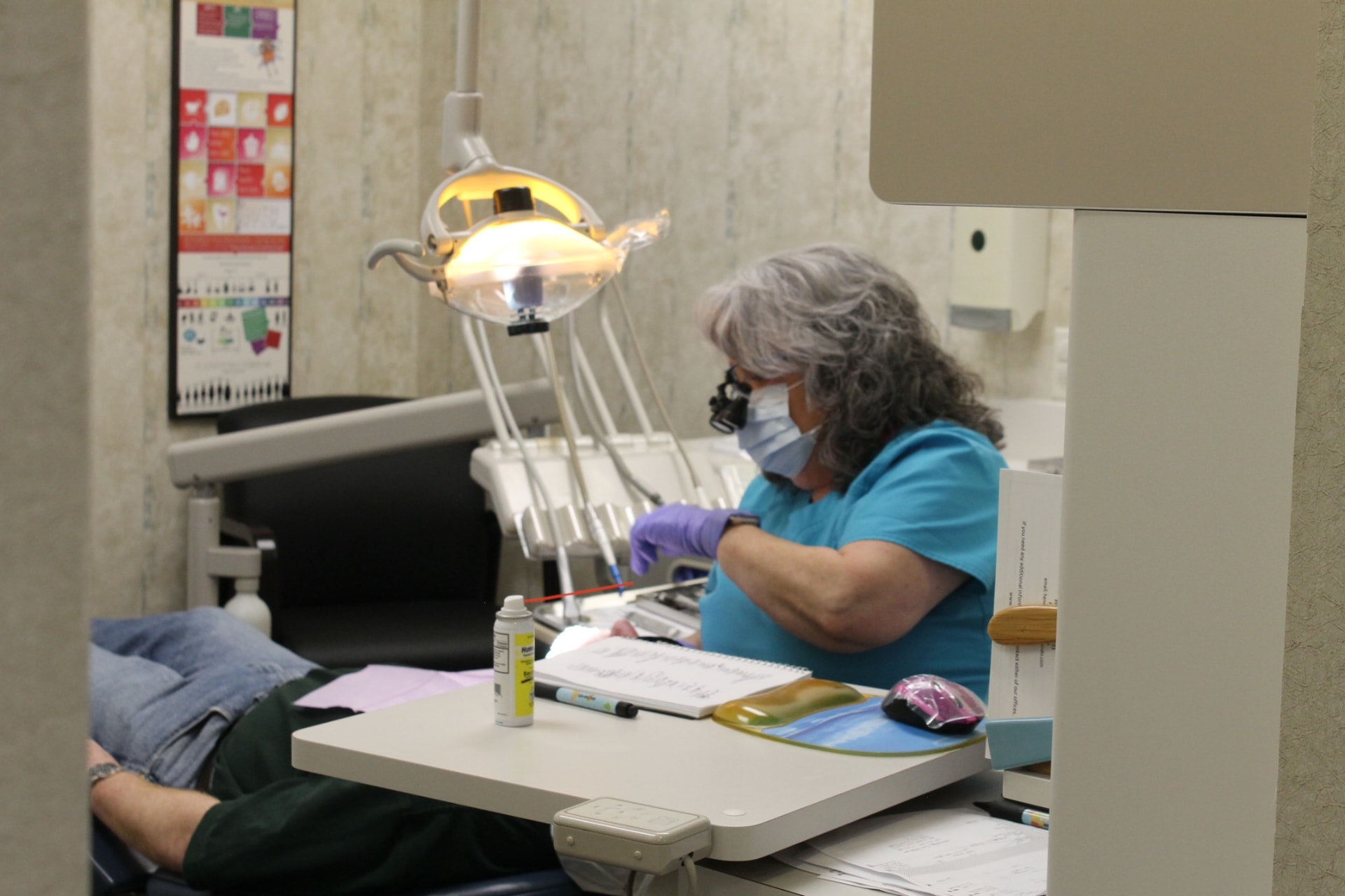 Julie, dental hygienist, caring for a patient in the dental chair